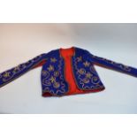 A Royal Blue bolero or matador type jacket with ap