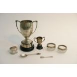 A bag of silver items including two trophy cups, s