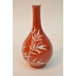 A small Chinese bottle vase decorated with white b