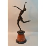 A large reproduction bronze of an Art Deco lady in