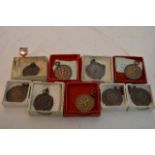 A collection of Silver and Bronze sporting medalli