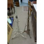 A brass telescopic lamp base and a painted lamp ba