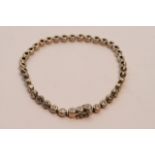 A ladies 18ct white gold tennis bracelet 1.50ct