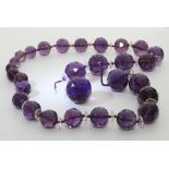 A large amethyst crystal necklace with faceted des