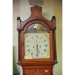 A mid 19th oak longcase clock with eight day paint