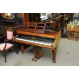 A John Broadwood rosewood baby grand piano on turn