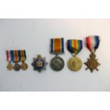 A group of First World War medals silver badge but