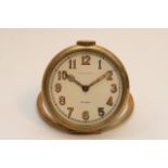 A Milton A.Fuller Art Deco brass travelling clock