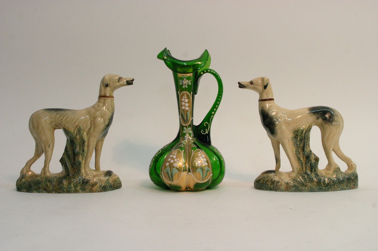 Two Staffordshire type dogs and a green glass jug