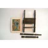 A carved wooden tribal art press and an Oriental p