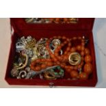A small box of various costume jewellery including