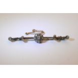 A fine quality white quality bar brooch set with a