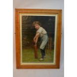 A maple framed print of a young boy playing cricke