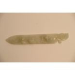 A Chinese white jade paper knife with relief carve