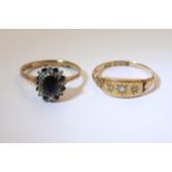 An 18ct gold ring set with three diamond chips and