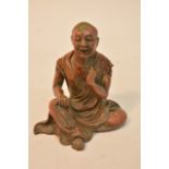 A small Chinese bronze Buddhist figure of a seated