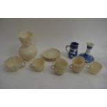 A Belleek vase and six cups and saucers, damage to