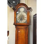 An oak long case clock with a brass face, approx 1