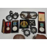 A collection of military medals, patches, goggles