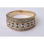 An 18c gold ring set with three rows of diamonds.