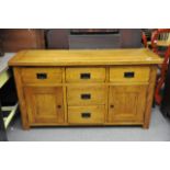 A Modern Oak sideboard fitted with drawers and two