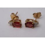 A pair of 9ct gold stud earrings set with square r