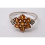 A boxed 9ct gold ring with star shaped yellow ston