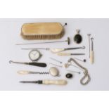 A collection of sewing tools, a silver watch, lock