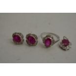 A 14ct white gold, ruby and diamond suite comprisi