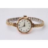 A 9ct gold ladies wrist watch, the enamel dial wit