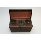 A George III mahogany tea caddy of sarcophagous sh