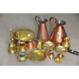 A collection of brass and copper including a coppe