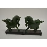 A Pair of Chinease Carved Jade horses on black lac