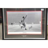 A mounted and framed signed George Best Manchester