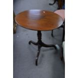 An early Victorian wine table the oval top on turn