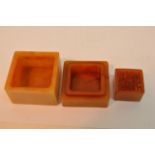 A square soapstone seal in conforming box, the lid