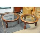 A pair of circular low occasional tables