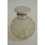 A Silver topped and cut glass scent bottle of sphe