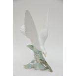 A Lladro bird ornament, approx 29cm.