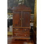 A mahogany cabinet approx 65cm x 34cm x 16cm.