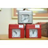 A collection of three metal cased pigeon clocks