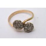 A double diamond cluster ring with 18ct gold band