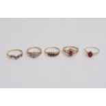 Five gold rings set with garnets and diamond chips