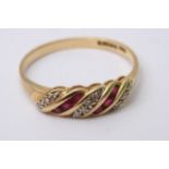 An 18ct gold ring inset with diamond and rubies