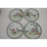 Four Oriental dishes with hand painted on transfer