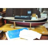 A scale built model of a single funnel boat sold w