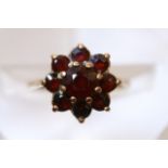 A gold garnet cluster ring