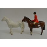 A Beswick Connemara horse and on other of a huntsm