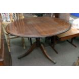 An inlaid mahogany oval dining table, approx 121cm