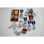 A collection of Masonic items including medals, a
